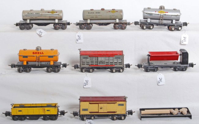 Lionel No. 1680 x2, 2654 x2, 655, 2656, 3652, 3659: Prewar Lionel O gauge freight cars, two 1680 Sunoco tanks; two 654 tanks one Shell, one Sunoco; 655 boxcar, 2656 stock car, 3652 gondola, 3659 dump car. 3659 is restored, 655 and 2656 are each missing