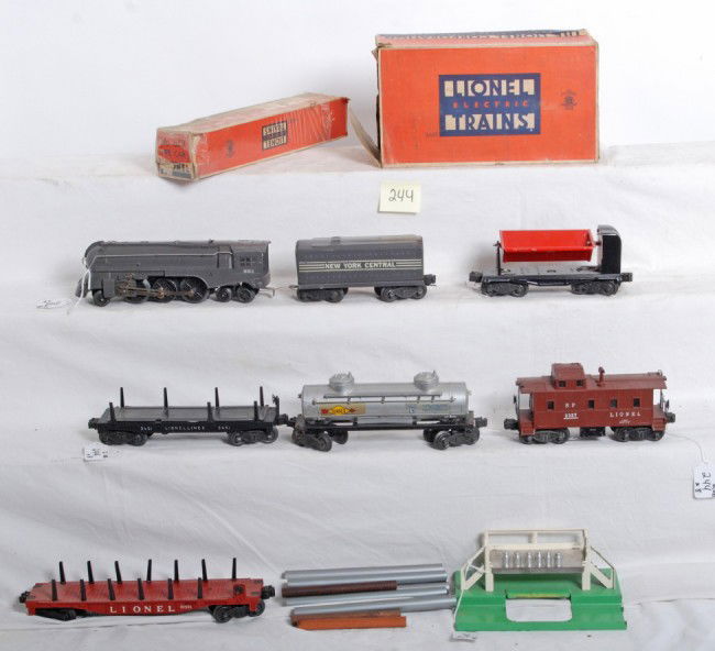 Lionel No. 221, 221T, 2465, 3451, 3559, 6511...: Postwar Lionel O gauge No. 221 streamlined steam locomotive with 221T New York Central tinplate tender, 2465 Sunoco tank, 3451 lumber car, 3559 dump car, 6511 pipe car w/pipes in worn OB, 2357 SP type