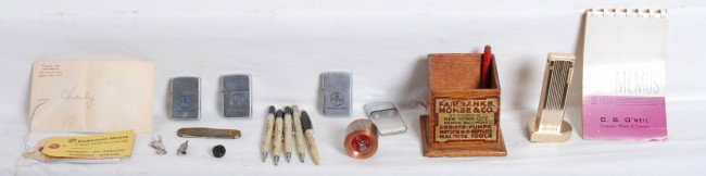 Fairbanks Morse employee items, Zippos, etc. : Really neat lot of Fairbanks Morse employee items. Includes Fairbanks Morse wooden pencil holder, six Fairbanks Morse pens and pencils of various styles, 1957 FM pocket calendar, two FM service tags, 