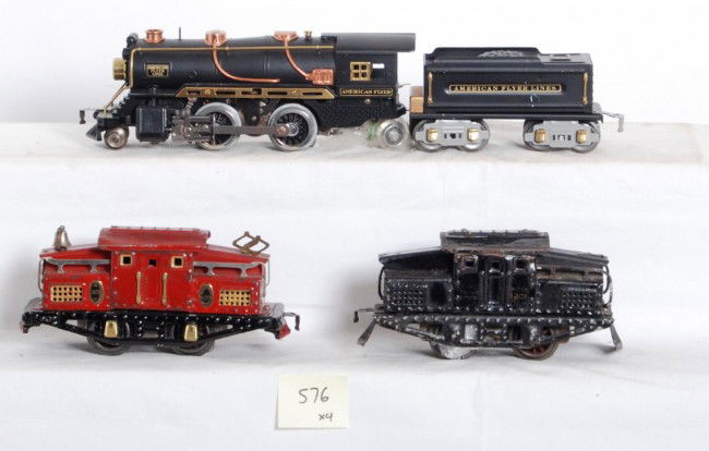American Flyer O gauge locos, electric and steam: Prewar American Flyer O gauge 1201 and 303 center cab electric locomotives and a repainted steam locomotive and tender. Electric locos look C5-6. Repainted loco looks C7 area.