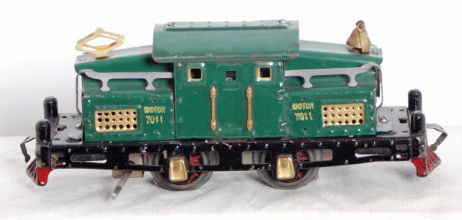 American Flyer 7011 center cab electric locomotive: Prewar American Flyer O gauge No. 7011 center cab electric locomotive, very small ding to cab roof edge, shiny clean C6. Two
