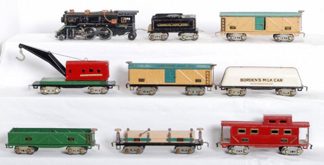 American Flyer O gauge electrical steam freight tr: Prewar American Flyer O gauge diecast steam locomotive with a tinplate eight wheel tender, BordenÕs Milk Car, 3216 lumber car with repro load and original load restraints, sand car, 3208 boxcar, deca