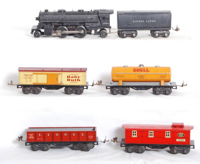 Lionel 1684, 1689W, 1677, 1679, 1680, 1682: Prewar Lionel O gauge No. 1684 loco, 1689W whistle tender, 1677 gondola, 1679 Baby Ruth boxcar, 1680 Shell tank, and 1682 caboose, trains are very clean and shiny C6-7.