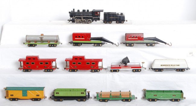 American Flyer O gauge switcher and freight cars: Prewar American Flyer diecast steam 0-6-0 switcher and diecast slopeback tender with backup light, two cabooses, two cranes, flatcar with lumber load and original load restraints, searchlight car, san