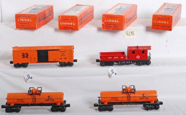 Lionel No. 6464-735, 6130, two 6315-60 in OB: Postwar Lionel O gauge No. 6464-735 New Haven boxcar, two No. 6315-60 chemical tank cars with coupler variation, and No. 6130 A.T.S.F. Santa Fe work caboose. Trains look C6-7. Boxes have light wear, 6