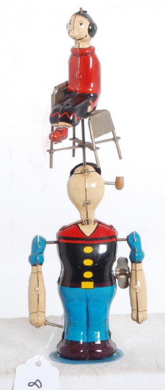 Linemar Popeye juggling Olive Oyl tin toy complete: Linemar Popeye juggling Olive Oyl tin toy complete, with functioning base/mechanics. Toy looks C7 area. Some light surface rust starting to form on chair.