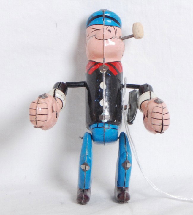 Linemar Toys tumbling Popeye tin windup toy: Linemar Toys tumbling Popeye tin windup toy, C7. Mechanism winds up and operates.