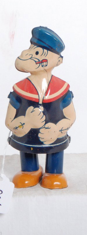 J. Chein walking tinplate windup Popeye toy: J. Chein walking tinplate windup Popeye toy. Mechanism winds up and functions. Toy looks C7-8.