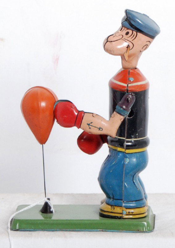 J. Chein & Co. speed bag punching Popeye tin toy: J. Chein & Co. speed bag punching Popeye windup tin toy. Toy looks C7-8. Toy is missing key.