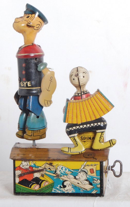 Marx Popeye Jigger and Olive Oyl accordion playing: Marx Popeye Jigger and Olive Oyl playing accordion, tin windup toy. Toy looks C6-7. Mechanism winds and functions.