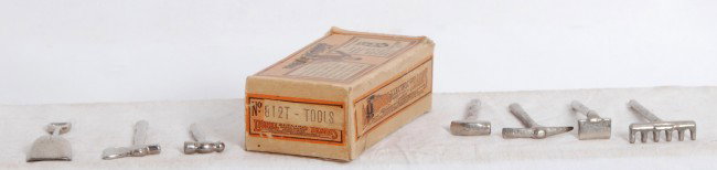 Lionel No. 812T- Tools in OB: Prewar Lionel No. 812T- Tools in original box. Some tools have a little very light surface rust, otherwise look shiny clean, C6. Box is square and solid with no missing flaps, C7-8. Tools were wrapped