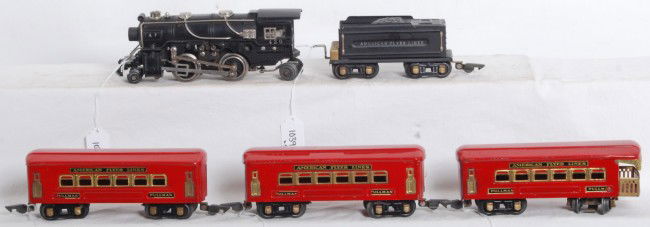 American Flyer 420 loco, tender, red passenger ca: Prewar American Flyer O gauge No. 420 diecast steam loco, tinplate tender, two Pullmans and an observation car. Trains look very nice C6++. Loco has a chipped pilot wheel.