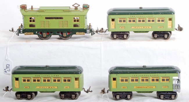 Lionel No. 253 loco, 607, 607, 608 passenger cars: Prewar Lionel O gauge No. 253 box cab electric loco, two 607 Pullman coaches, and 608 observation passenger cars. One loco wheel has casting fatigue. Trains look nice C6+.