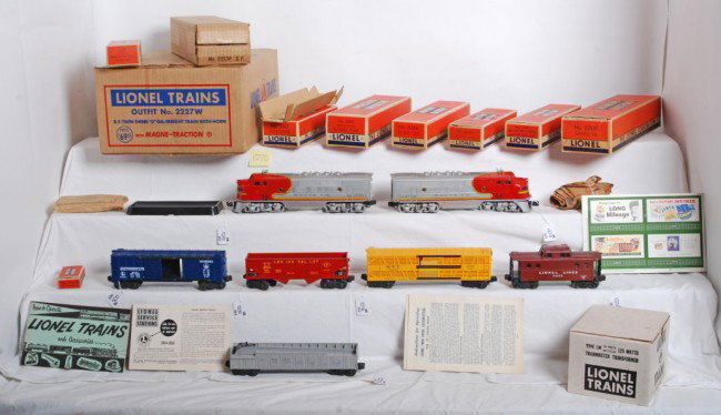 Boxed Lionel Outfit No. 2227W S.F. freight train: Postwar Lionel O gauge boxed Outfit No. 2227W S.F. twin diesel O Ga. freight train with horn. Train is comprised of 2353P and 2353T Santa Fe EMD F3a diesel units, 3562-25 operating barrel car with ins