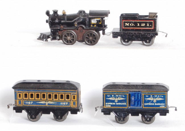 American Flyer No. 10? loco, 121, 1107, 1108: Prewar American Flyer O gauge cast iron mechanical steam locomotive with a four wheel tinplate No. 121 tender, 1107 coach and a 1108 baggage car. Trains look C6 area.