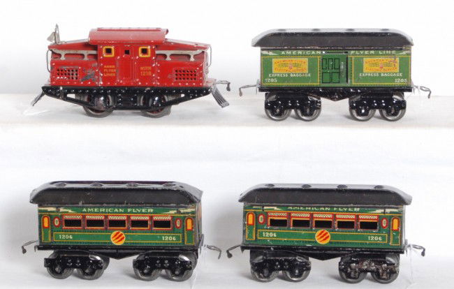 American Flyer 1218 loco with three lightning bol: Prewar American Flyer narrow gauge No. 1218 loco, 1205 baggage, and two 1206 passenger coaches. Trains look C6 area.