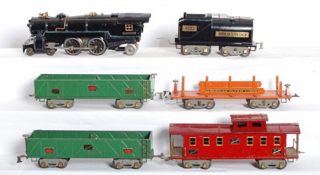 American Flyer 4692 loco, 4693 tender, 4022, 4017: Prewar American Flyer wide gauge No. 4692 steam locomotive with 4693 tender, restored to look C6-7. 4022 miscellaneous car, two 4017 sand cars and a 4021 caboose, C6 area.
