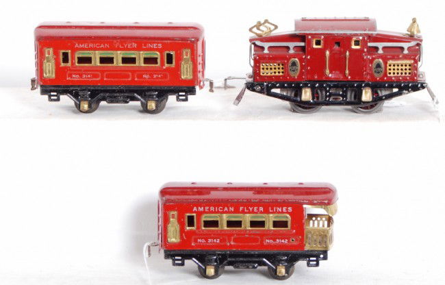 American Flyer mechanical steam passenger train: Prewar American Flyer O gauge mechanical tinplate steam loco and Limited four wheel tinplate tender with battery compartment, four wheel tinplate automobile car, four wheel tinplate stock car?, four w