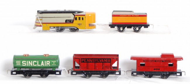 American Flyer Hiawatha freight train: Prewar American Flyer O gauge Hiawatha freight train with Hiawatha loco and tender, 1228 Sinclair tank, 311267 Pennsylvania hopper, 1127 caboose. Trains look C6 area.