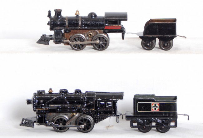 American Flyer/Hafner? cast iron, cast aluminum l: Prewar American Flyer/Hafner cast iron and cast aluminum steam locos with tin plate tenders. Both locos are mechanical with one key, one tender is No. 1190 Santa Fe. Trains look C6 area.