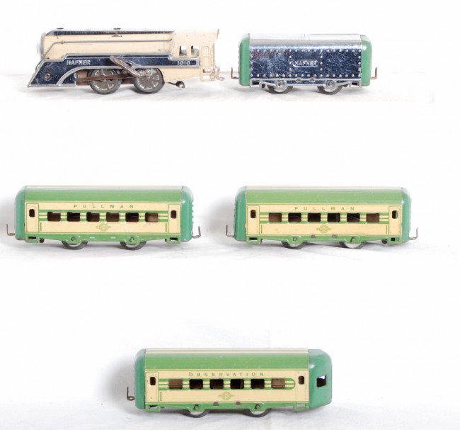 Hafner 1010 steam loco, tender and passenger cars: Prewar Hafner O gauge mechanical tinplate No. 1010 steam loco, tinplate tender, two four wheel tinplate Pullman coaches and a four wheel tinplate observation, passenger cars. Trains look C6+.