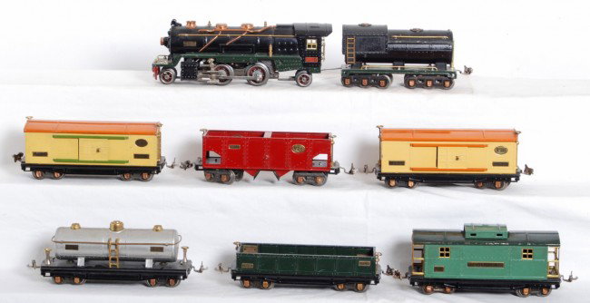 Lionel 260-E, tender, 812, 814, 814, 815, 816, 81: Prewar Lionel O gauge No. 260-E steam locomotive, unnumbered tender, 812 gondola, two 814 boxcars, 815 tank car, 816 hopper, 817 caboose. Trains are clean and shiny C6 area.