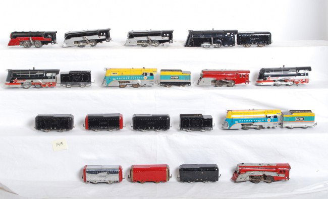 Fifty-eight Hafner trains, locos, tenders, freigh: Prewar and postwar Hafner O gauge trains. Steam locomotives and tenders, freight cars and passenger cars. Trains range C4 to C7. Locos are all mechanical, most have a key.