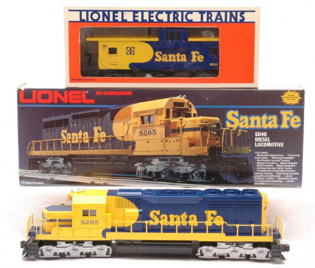 Lionel Santa Fe 8265 SD40 Diesel 6903 Caboose MIB: Lionel 8265 Santa Fe SD40 diesel loco and 6903 Santa Fe extended vision caboose both in OBs. The loco and caboose have never been run C10. The 8265 OB is missing the Styrofoam insert.