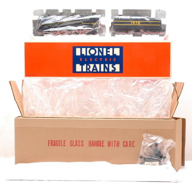 Lionel 8615 L&N Berkshire with Display Case MIB: Lionel 8615 Louisville & Nashville 2-8-4 Berkshire steam loco and tender with display case that has wooden board and bumpers both factory new in OB, C10. This was a special Christmas 1986 offering fro