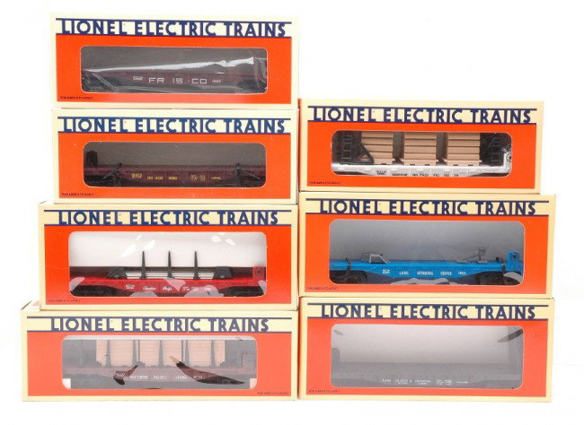 Lionel 16373 16379 16382 16386 16395 16923 19413: Lionel freight cars including; 16373 Erie Lackawanna flatcar, 16379 Northern Pacific flatcar with wood load, 16382 Kansas City Southern flatcar with bulkheads, 16386 Southern Pacific flatcar with load