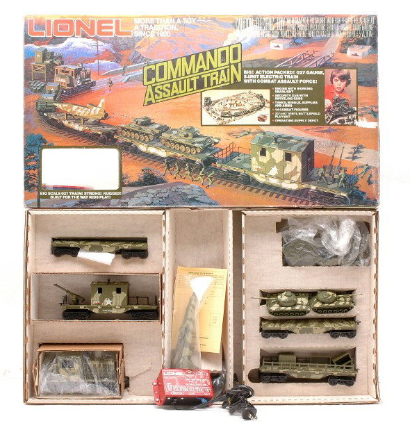 Lionel Commando Assault Freight Set 1355 LN MIB: Lionel Commando Assault freight train set no. 1355 in OB. The set appears to be complete but is missing the track. The set is C8, however some of the plastic pieces are broke.