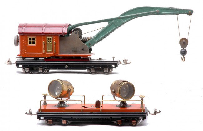 Lionel Prewar 810 Crane 820 Floodlight Cars: Lionel prewar O gauge 810 terra cotta crane with maroon roof, peacock boom, nickel journals and brass trim and a 820 floodlight car with terra cotta base, brass trim and copper journals. The crane has