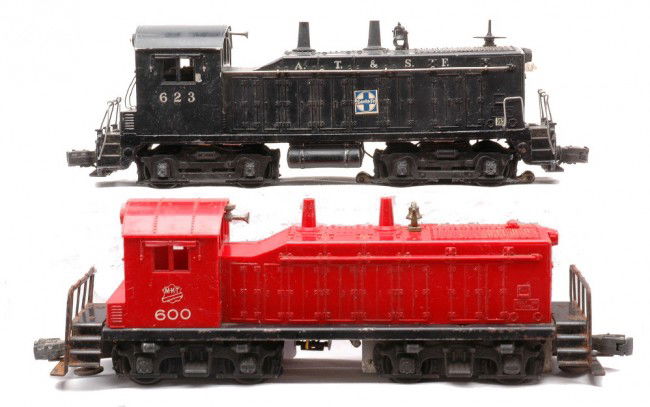 Lionel 600 MKT 623 Santa Fe NW2 Switchers: Lionel postwar 600 MKT NW2 switcher and a 623 Santa Fe NW2 switcher. The 600 is C4 and the 623 is C5.
