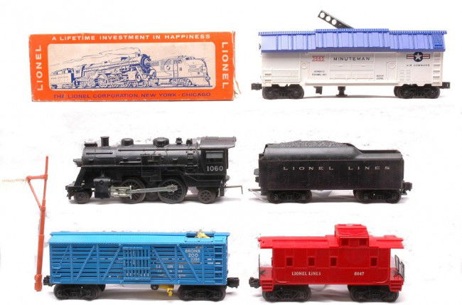 Lionel Postwar 1060 1060T 3386 3665 6047: Lionel postwar 1060 black 2-4-2 steam loco, 1060T tender, 3386 Bronx Zoo giraffe car with a tell-tale signal, 3665 U.S. Air Force Minuteman car in OB and 6047 caboose. The loco, tender and cars are C7