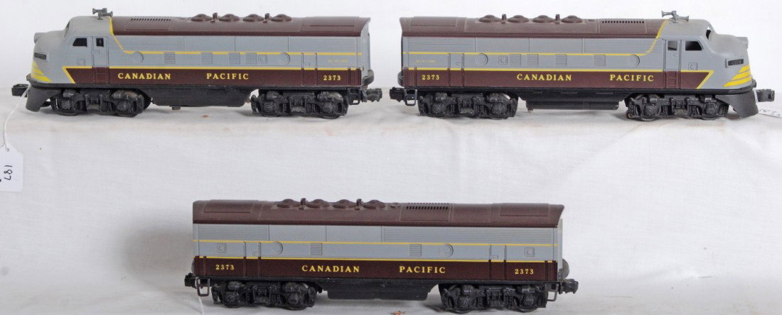 Repro Lionel 2373 C.P. A-B-A both A units powered: Units appear to be repro Lionel 2373 Canadian Pacific F3 diesel A-B-A units with postwar chassis. One A unit has single motor and other has dual motors. B unit is dummy. Trains should clean to look ni