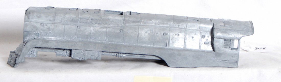 Lionel J Class 746 modern shell rough casting: Lionel modern O Gauge rough J Class 746 locomotive shell casting. Shell is unpainted and still has much of the casting flash in certain areas. This shell was most likely a factory reject that escaped.