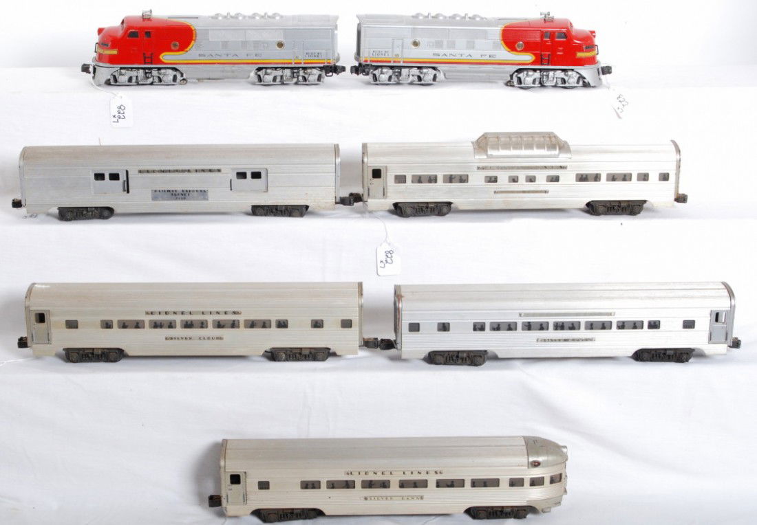 Lionel No. 2343 S.F., 2530, 2531, 2532, 2533, 2533: Postwar Lionel O gauge No. 2343 Santa Fe EMD F3 AA diesels with clean battery compartment, original screens roof louvres and porthole lens, 2530 REA baggage, 2531 Silver Dawn, 2532 Silver Range vista