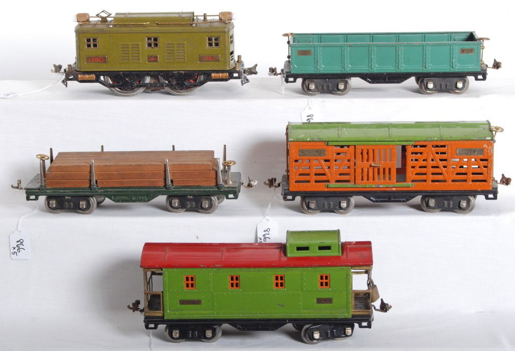Lionel No. 8E loco, 511, 512, 513, 517 freight: Prewar Lionel standard gauge 8E boxcab electric locomotive, 511 flatcar w/lumber load, 512 gondola, 513 stock car, and 517 caboose, C5-6. Loco has been rewheeled.