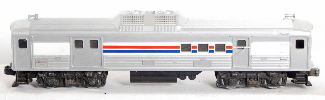 Lionel Amtrak Budd RDC factory error: Lionel modern O Gauge Amtrak RDC Budd car factory error. Shell has stripes but no number, letter, or logo stampings. Frame has some rust and and frozen pickup roller. Shell has a few nicks. C7+.