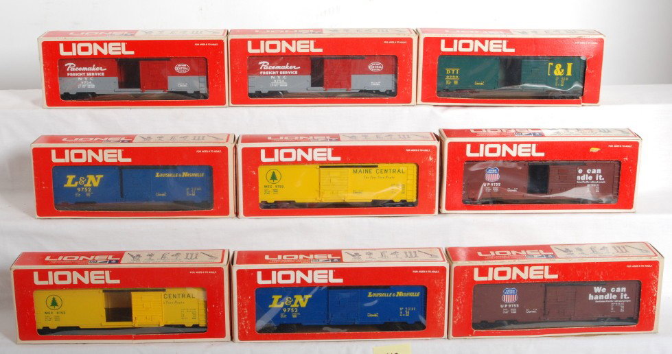 9 Lionel 9700 boxcar variations: Lionel modern O Gauge 9700 boxcars. Nine cars each with variation written on box end includes 9752 L&N in high gloss blue and 9752 in flat, 9755 Union Pacific brown body mold with brown paint and whit