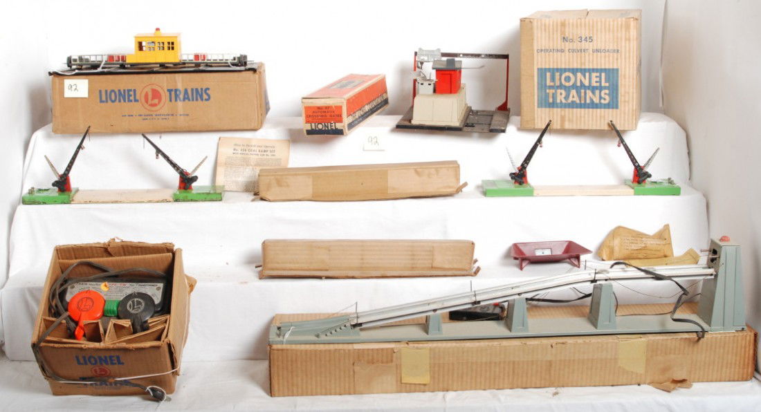 Lionel 345, 350, 456, 47, type TW, in OB 47 w/inser: Postwar Lionel O gauge 345 operating culvert unloader, 350 engine transfer table, 456 coal loading ramp, two 47 automatic crossing gates. Accessories should clean to look C-7. All are in original boxe