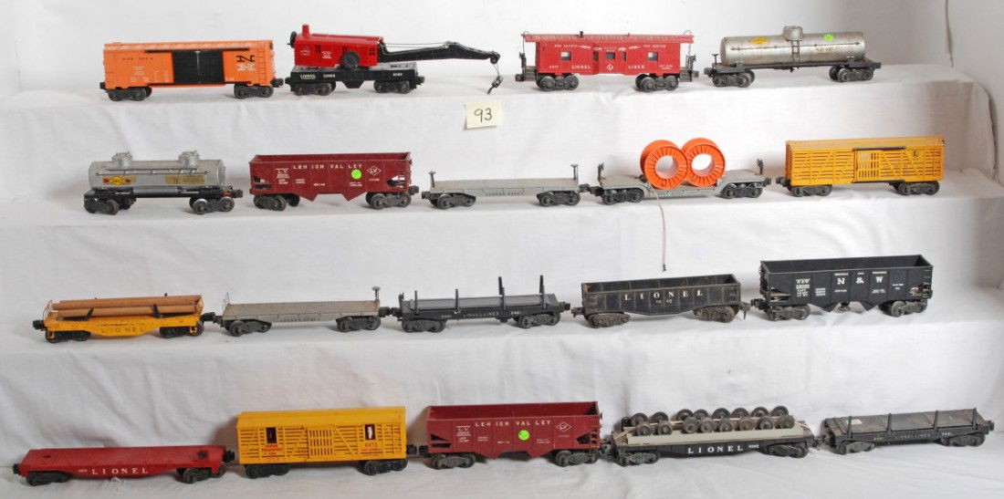 Huge lot of Lionel O gauge freight cars: Postwar Lionel O gauge freight cars, chipped or missing catwalks ends, light surface rust, etc. C4-6. 6262, 6818, 2411, 6411, two 3461, unnumbered pipe car, 6473, two 6456, 2465, 2555, 3456, 1002, 665