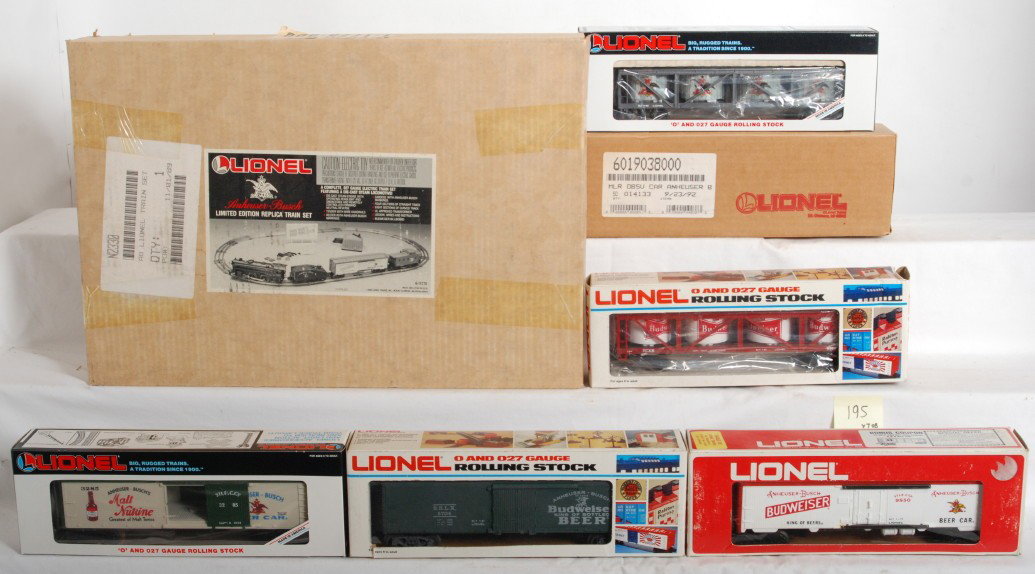 Lionel Budwiser train set and freight cars: Lionel modern O Gauge Budwiser 11775 train set and six freight cars. Set is C8-9 and is complete with very little signs of run time. Six Budwiser freight cars include 16805 reefer, 19038 observation c