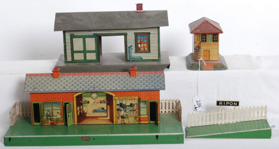 Ives, Meccano Hornby Series, Bing buildings: Prewar Ives freight station, Meccano Hornby Series train station, and Bing switch tower. Buildings look C6 and should clean to look a little better.