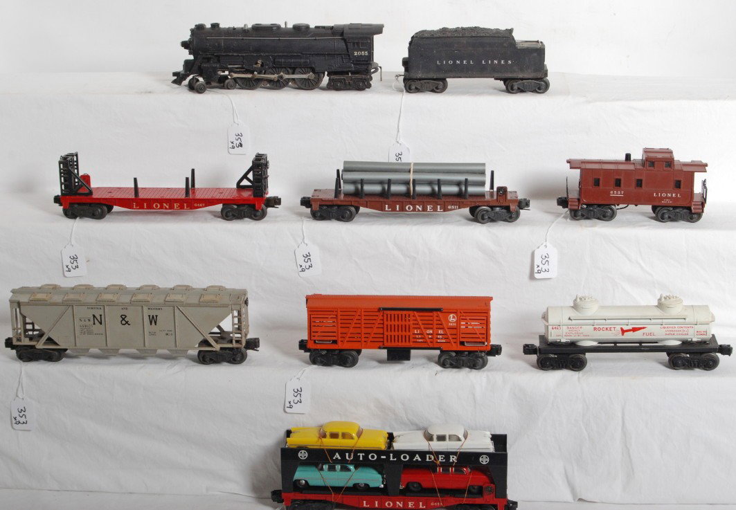 Lionel 2055, 2466WX, 6467, 6414, 6446-25, 6557...: Postwar Lionel O gauge No. 2055 steam locomotive, 2466WX whistle tender, 6467 miscellaneous car, 6414 Evans Auto-Loader, 6446-25 Norfolk and Western covered hopper, 6463 rocket fuel tank (chipped), 65