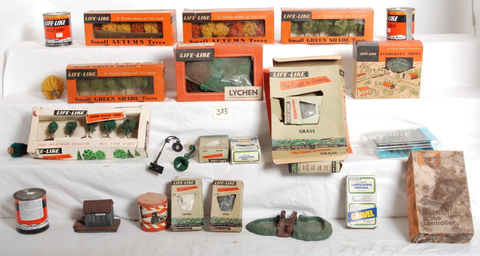 Large lot of Life-Like layout materials, most in O: Large lot of Life-Like layout materials, most in original boxes, some factory sealed. Grass, coal, shade trees, autumn trees, gravel, ballast cement and more. Some boxes have wear. Please view the pho