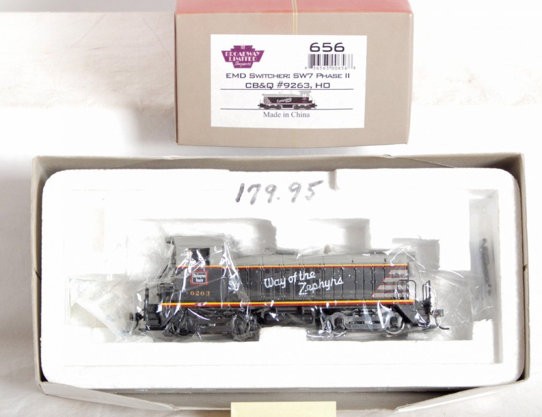 Broadway Limited CB&Q SW7 switcher: Broadway Limited modern HO 656 CB&Q Burlington SW7 switcher in OB. Loco is from the Paragon series and is equipped with QSI sound. Loco is NOS C9-10. OB has some sun fading on end.