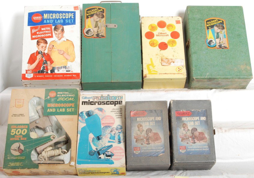 8 Gilbert microscope sets: Gilbert Postwar microscope sets. Eight sets include a number 10 wood box set, 13093 microscope set, 31300 rainbow microscope, 13081 set, what appears to be a second 13081, but is missing inside insert