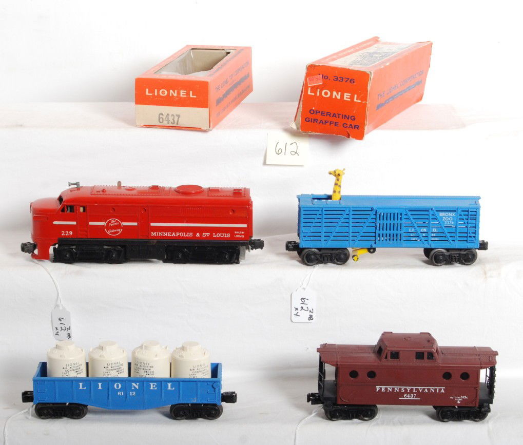 Lionel 229 M.St.L., 6112, 3376, 6437 w/two boxes: Postwar Lionel O gauge No. 229 Minneapolis and Saint Louis Alco diesel A unit with No. 6112 gondola with four white canisters, No. 3376 operating giraffe car, and No. 6437 Pennsylvania porthole caboos