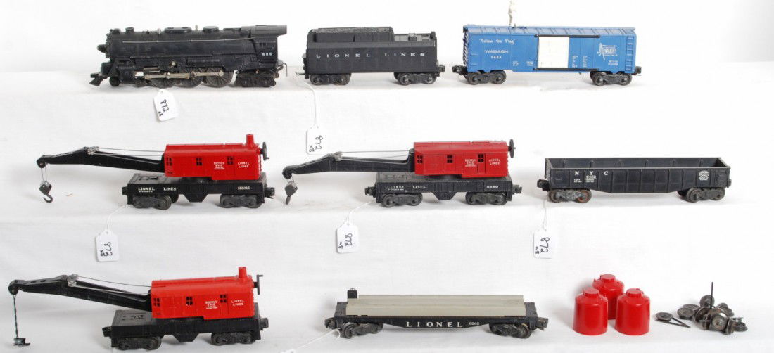 Lionel 685, whistle tender, 3424, 6462, 6262, cran: Postwar Lionel O gauge 685 steam locomotive with whistle tender, 3424 Wabash operating brakeman car, 6462 NYC gondola, 6262 wheel car, 6460 crane (bent step/corner), 6560 crane, 6560-25 crane. Trains